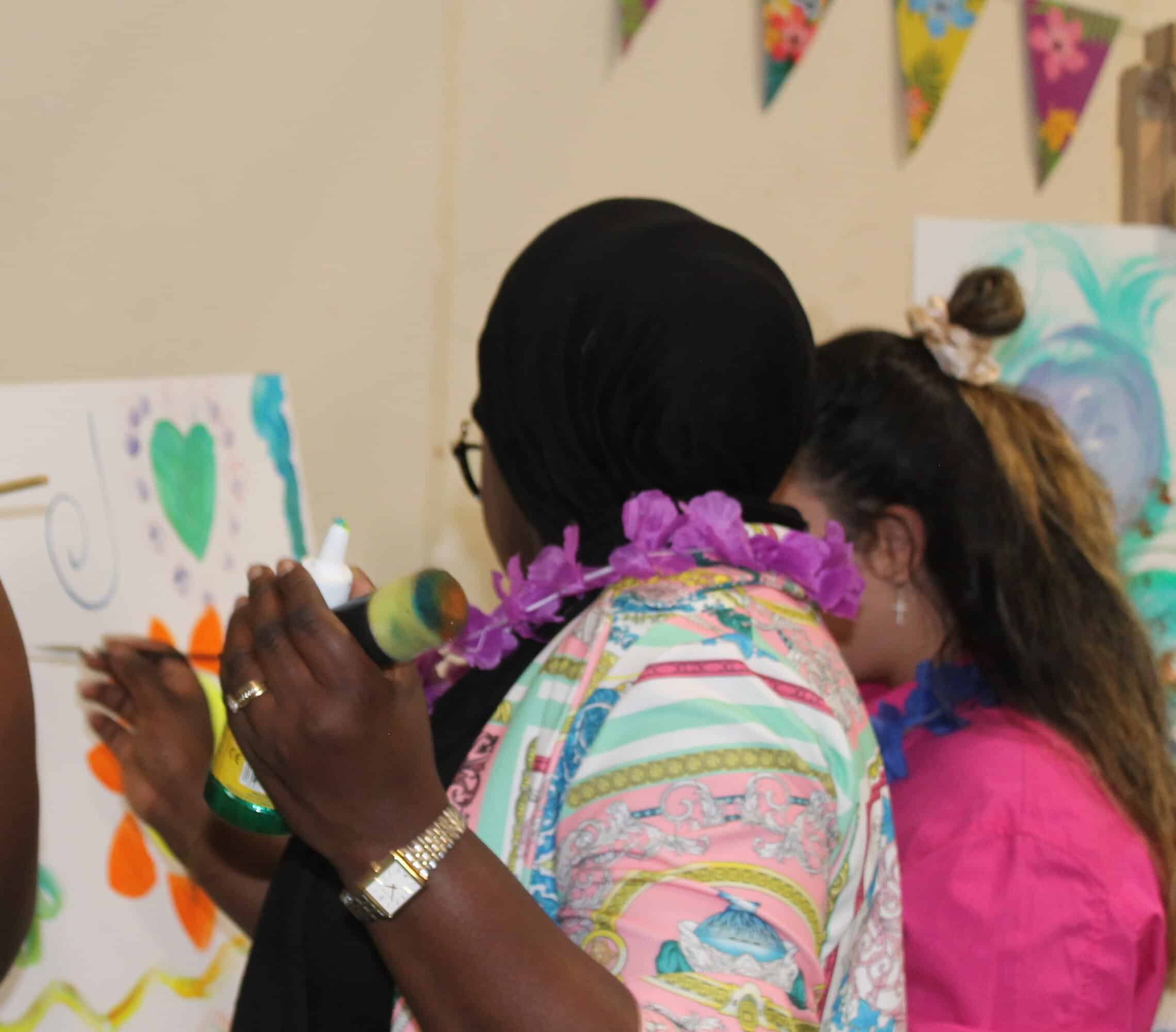 A member of staff painting