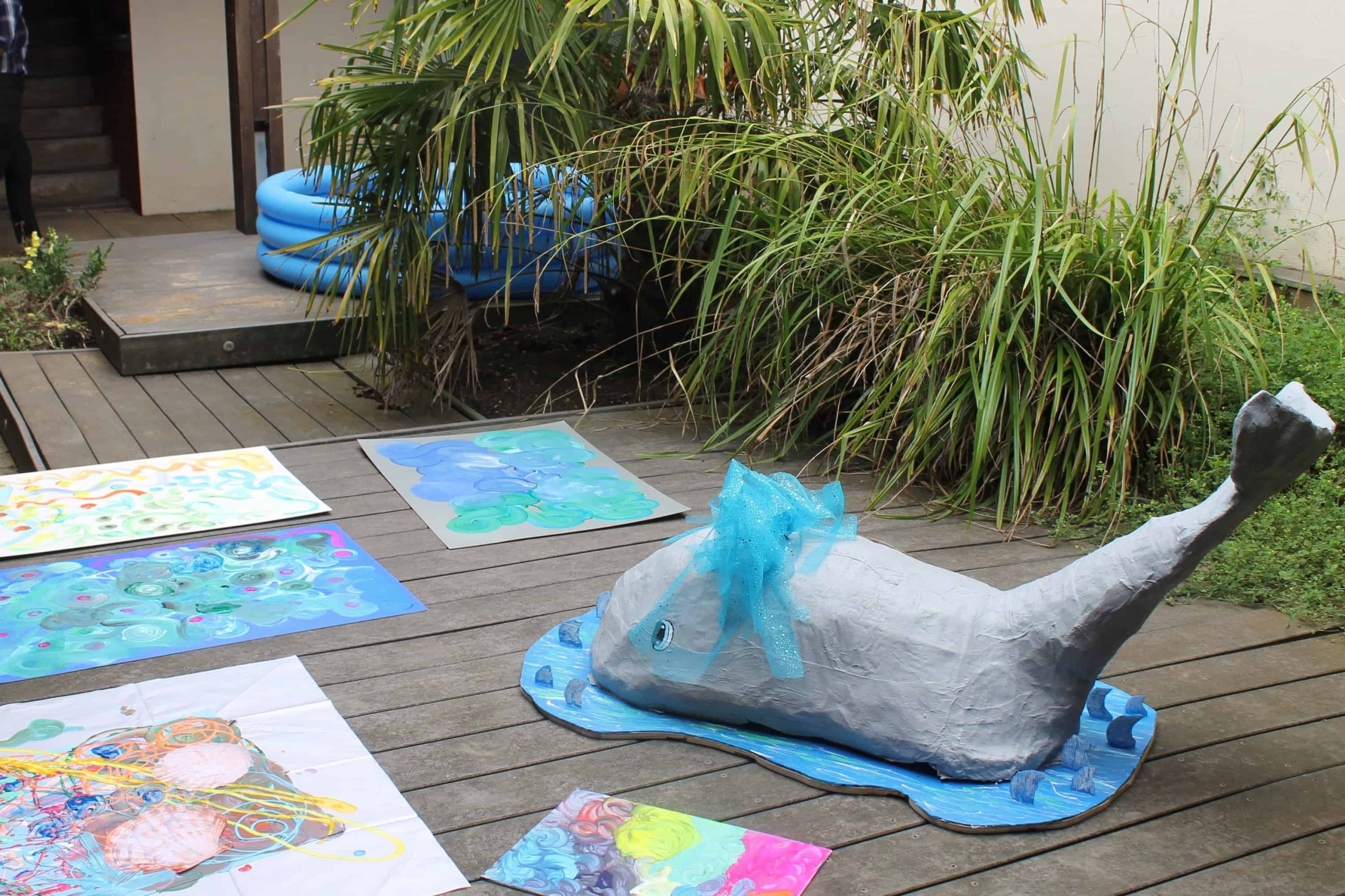 A picture of painting and a papier-mâché whale 