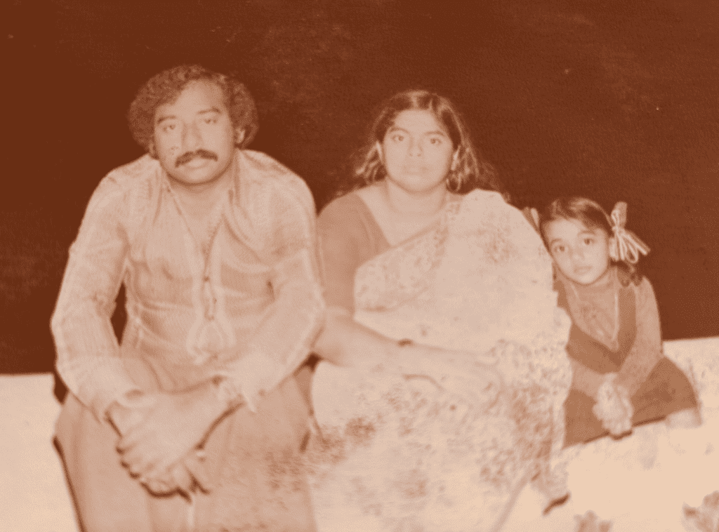 Fabida pictured with her parents 