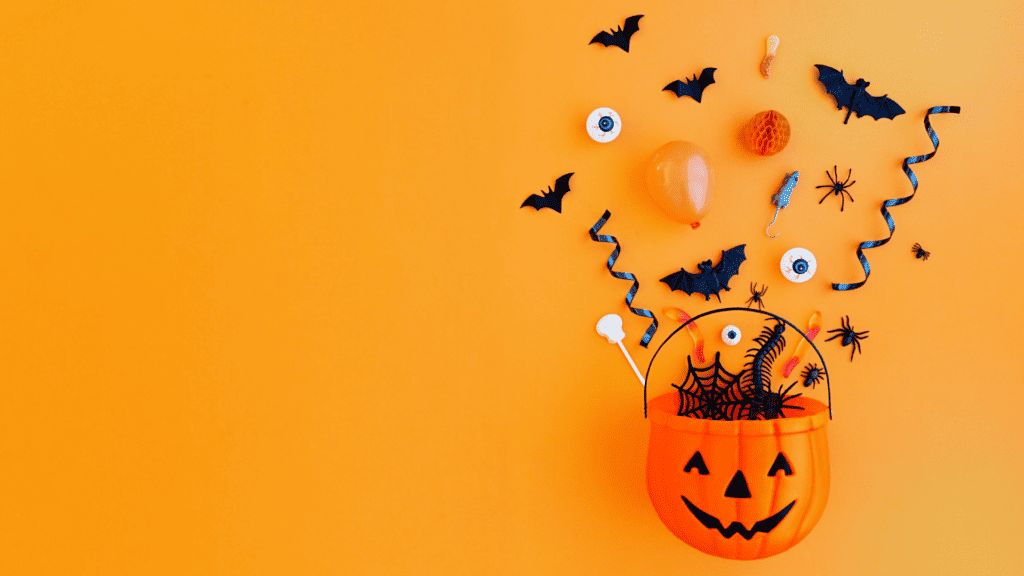 A halloween pumpkin bowl with sweets
