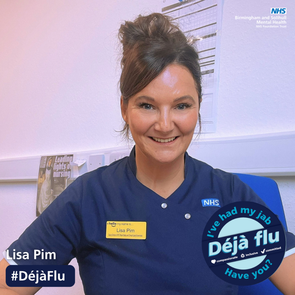 Lisa Pim smiling with a badge to say she has had her flu jab