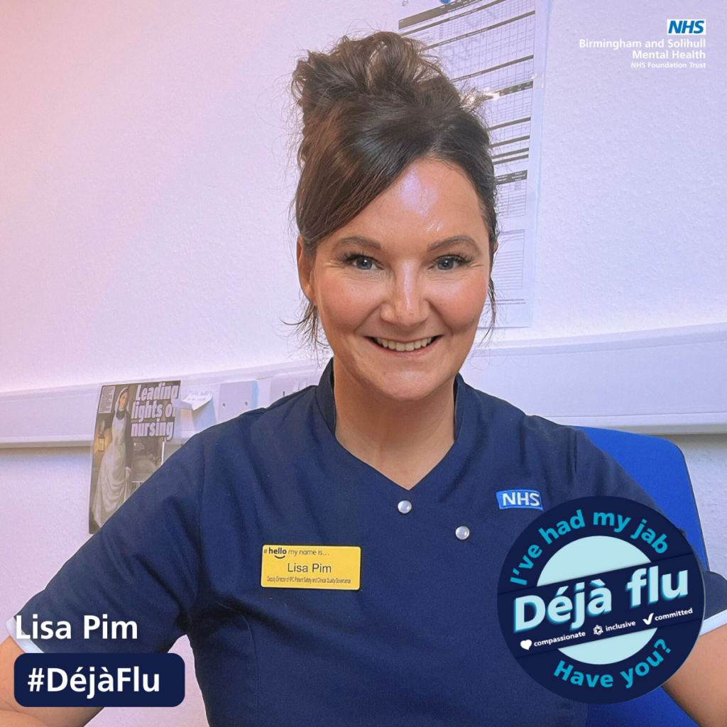 Lisa Pim smiling with a badge to say she has had her flu jab 