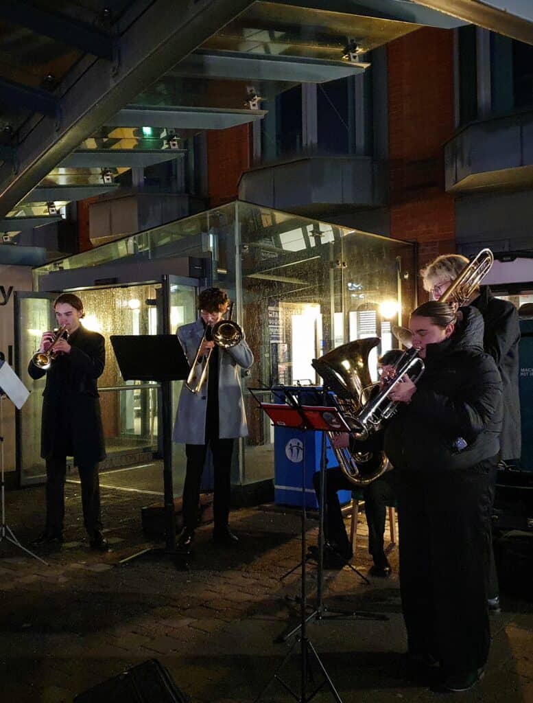 A Christmas band playing instruments 