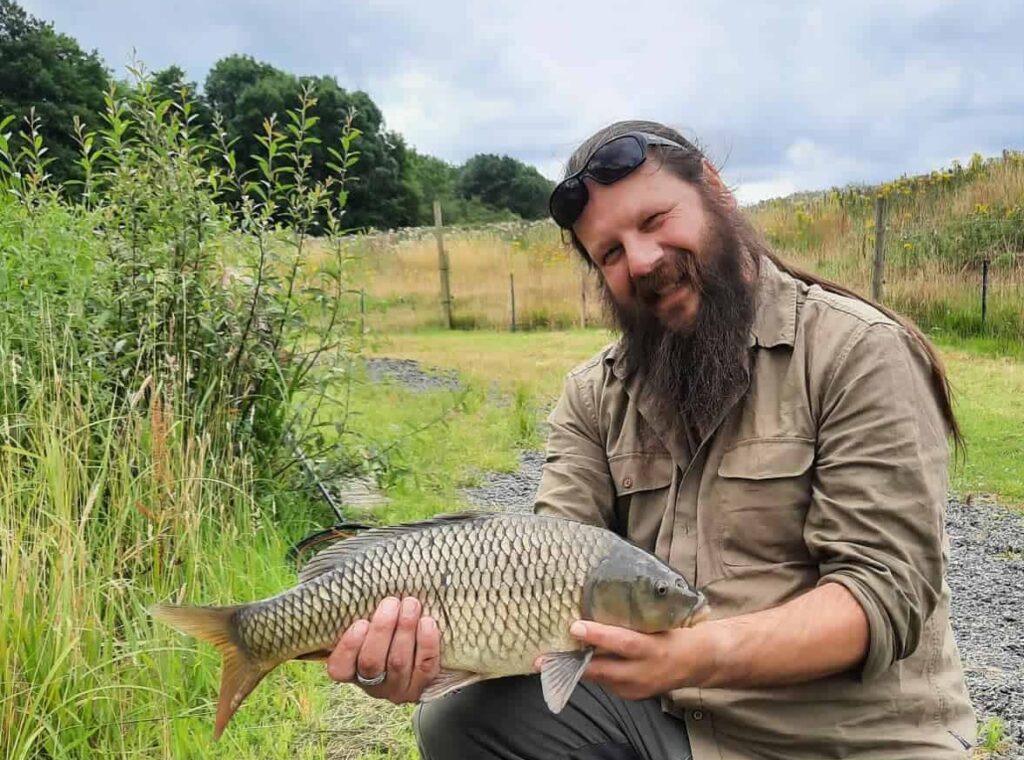 Service user, Leigh with a carp