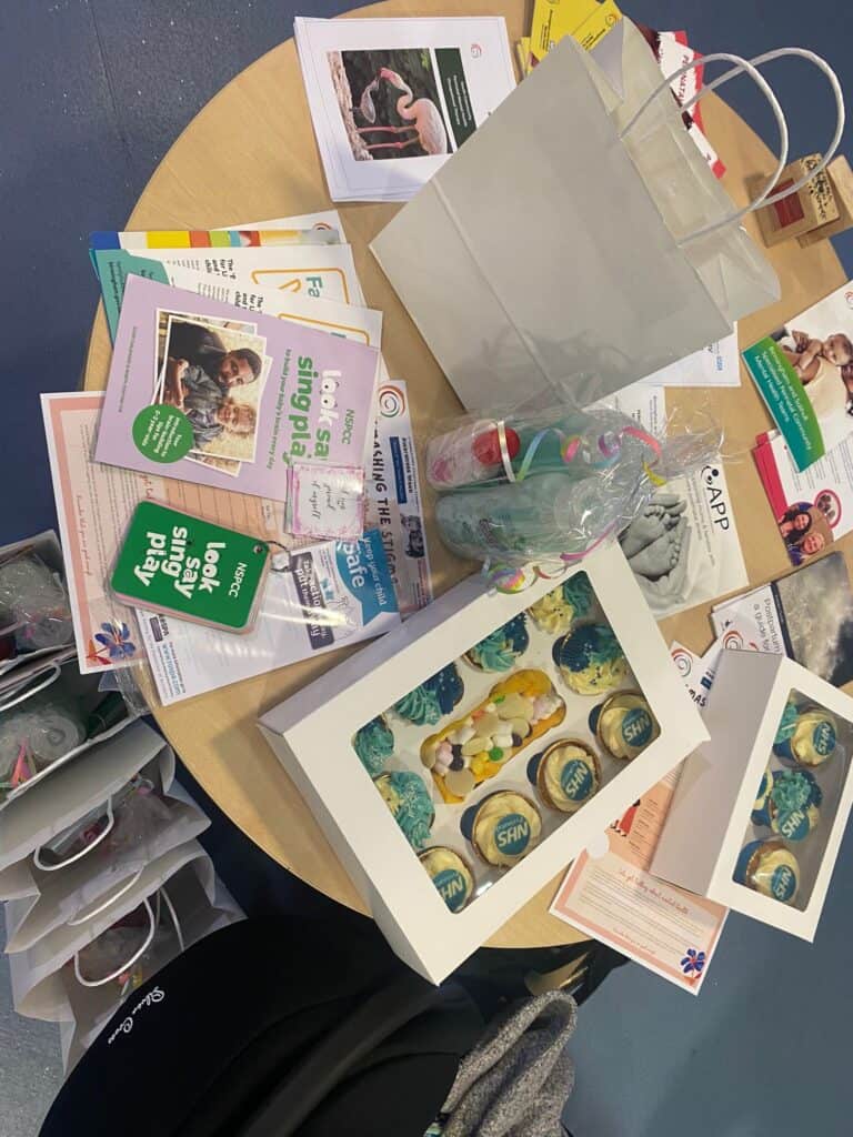 leaflets and cupcakes on a table 