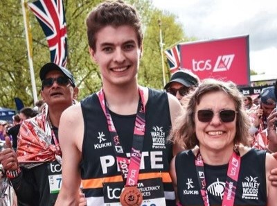 Sally and her son with their medals 