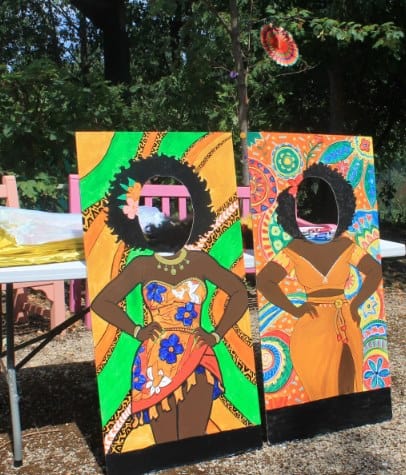 Vibrant African-themed artwork with two women in traditional attire.